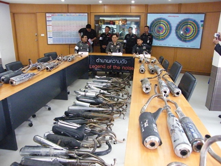 Pattaya Police Superintendent Nanthawut Suwanla-Ong (seated, center) has ordered officers to crack down on modified bikes.